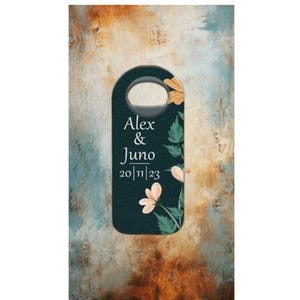 May include: Dark teal door hanger with a floral design and the names "Alex & Juno" along with the date "20/11/23" in white script. The floral accents include peach-colored flowers and green leaves. The background has a textured, abstract design.