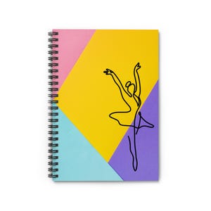 May include: A spiral bound notebook with a colourful cover featuring a single line drawing of a ballerina in a yellow, pink, blue, and purple colour scheme.