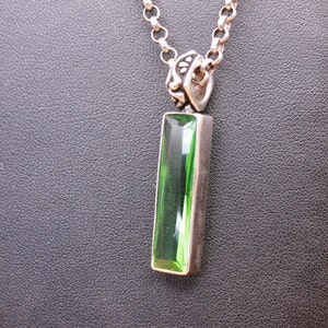 Emerald green faceted glass drop pendant