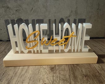 "Home Sweet Home" letters on a wooden base