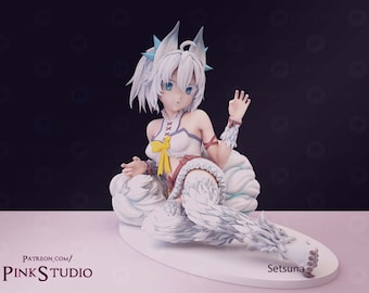 May include: A white anime-style figurine of a seated character with white hair, blue eyes, and fox-like ears. The figure wears a white and purple outfit with a yellow bow. The base is white, and the text "Setsuna" is visible.