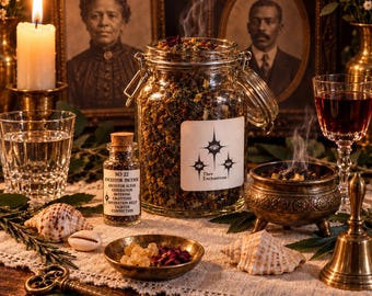 May include: A clear glass jar filled with dried herbs and incense, featuring a label with three star symbols and the text Thee Enchantress. Beside it sits a small corked bottle labeled NO 22 ANCESTOR INCENSE, a brass bowl with resin, and a metal key.