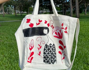 野原にいる女の子が描かれた手作りの買い物バッグ