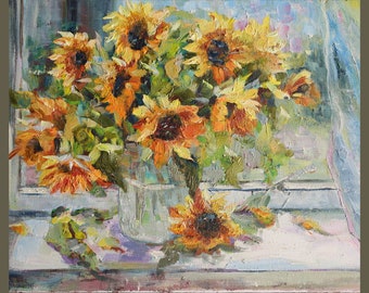 May include: A painting of a bouquet of sunflowers in a clear glass vase on a windowsill. The sunflowers are in various shades of yellow and orange, with green leaves and stems. The background is a blurry blue and white.