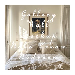 May include: A bedroom with a white wall and a framed painting above a bed with a white linen duvet and beige pillows. The text "Gallery Wall Mockup Boho Cream Bedroom" is written over the image.