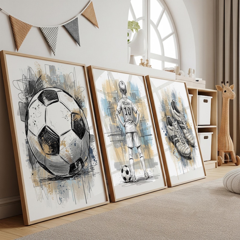 May include: Set of three framed soccer-themed art prints. The prints feature a detailed soccer ball, a soccer player in a jersey, and a pair of soccer cleats. The artwork is in black, white, and shades of blue and tan.