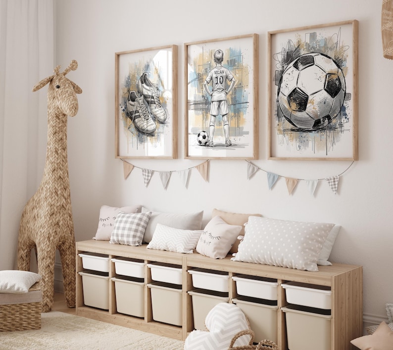 May include: Three framed watercolor prints with a soccer theme. One shows soccer cleats, another a soccer player, and the third a soccer ball. The prints are in wooden frames and hang above a storage bench with white bins.