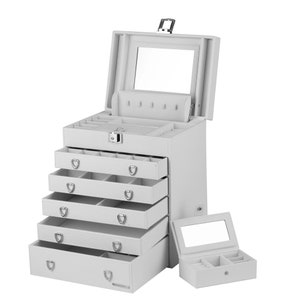 May include: White jewelry box with a mirror and five drawers. The top drawer has a compartment for rings and earrings. The box has a lock and key.