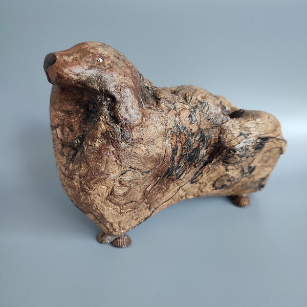Figurine of a brown dog made of driftwood