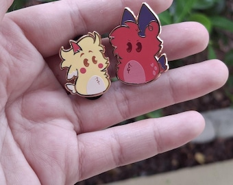 Alastor and Lucifer Dumpling pins! (1 in and 1.3 in)