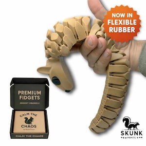 Flexible 3D printed squirrel fidget toy for sensory seekers, ADHD, and autism, shown bending in a hand with premium gift box packaging by Skunk Prints