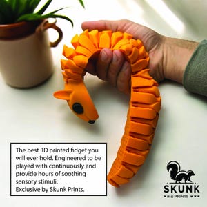 May include: Orange 3D-printed fidget toy in the shape of a squirrel, held in a hand. The toy has a segmented body and a small head with black eyes. Text on the image reads: "The best 3D printed fidget...Exclusive by Skunk Prints."