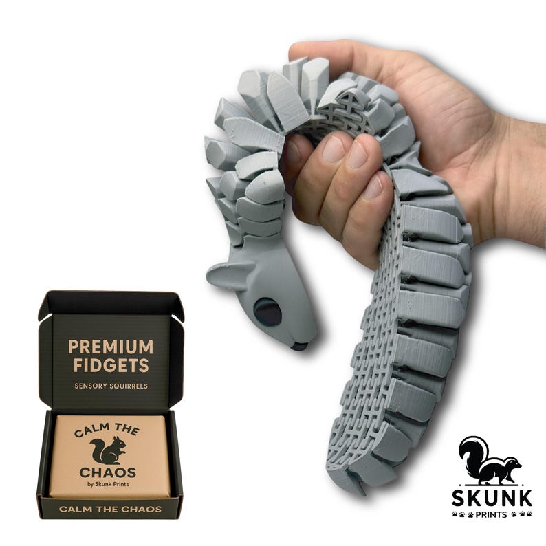 Sensory Squirrel fidget toy in playful motion, tail flipping upward when the hips are squeezed. The articulated diamond-pattern body flexes smoothly and creates a gentle ASMR clack sound. Designed as a unique stress-relief desk toy for adults, this full-size squirrel toy offers tactile sensory feedback and endless entertainment at work or home