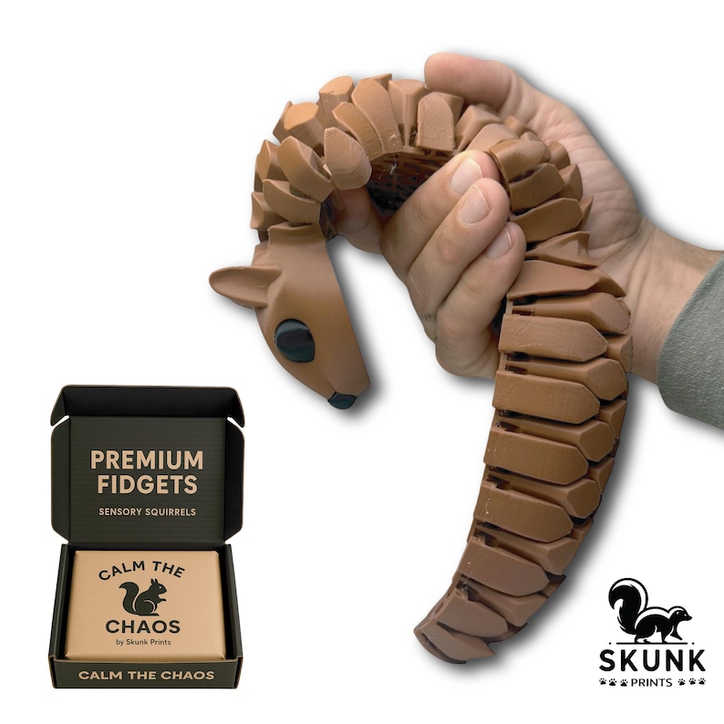 Full-size Sensory Squirrel fidget toy displayed on a clean white desk with natural light, showing its realistic lifelike shape and articulated flexible body. Designed for adults as a premium desk toy, this tactile squirrel provides unique sensory feedback and stress relief, making it a calming office companion unlike standard fidgets or stress balls.