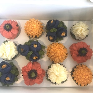 1-Dozen Floral Cupcakes: 3-Poppies; 3-Carnations; 3-Freesias; 3-Marigolds (Delivered only in Nashville, TN and surrounding Nashville cities)