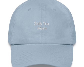 May include: A light blue baseball cap with white embroidery that reads "Shih Tzu Mom".