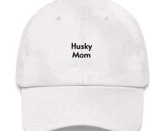 May include: White baseball cap with black embroidered text that reads "Husky Mom".