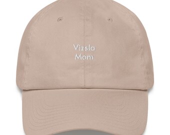 May include: A beige baseball cap with the text "Vizsla Mom" embroidered in white on the front.