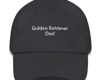 May include: A dark gray baseball cap with white embroidered text that reads "Golden Retriever Dad".