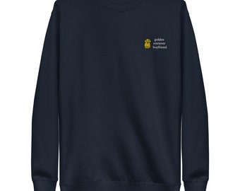 May include: A navy blue sweatshirt with a small embroidered golden retriever puppy and the text "golden retriever boyfriend".