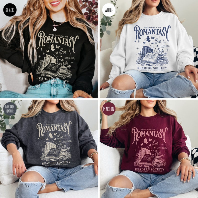 May include: A black, white, dark grey heather, and maroon sweatshirt with a graphic print of a stack of books, butterflies, and the text "Proud Member of the Romantasy Readers Society".