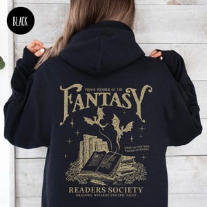 May include: Black hooded sweatshirt with a gold graphic print of a dragon and books. The text reads "Proud Member of the Fantasy Readers Society, Dragons, Wizards and Epic Tales".