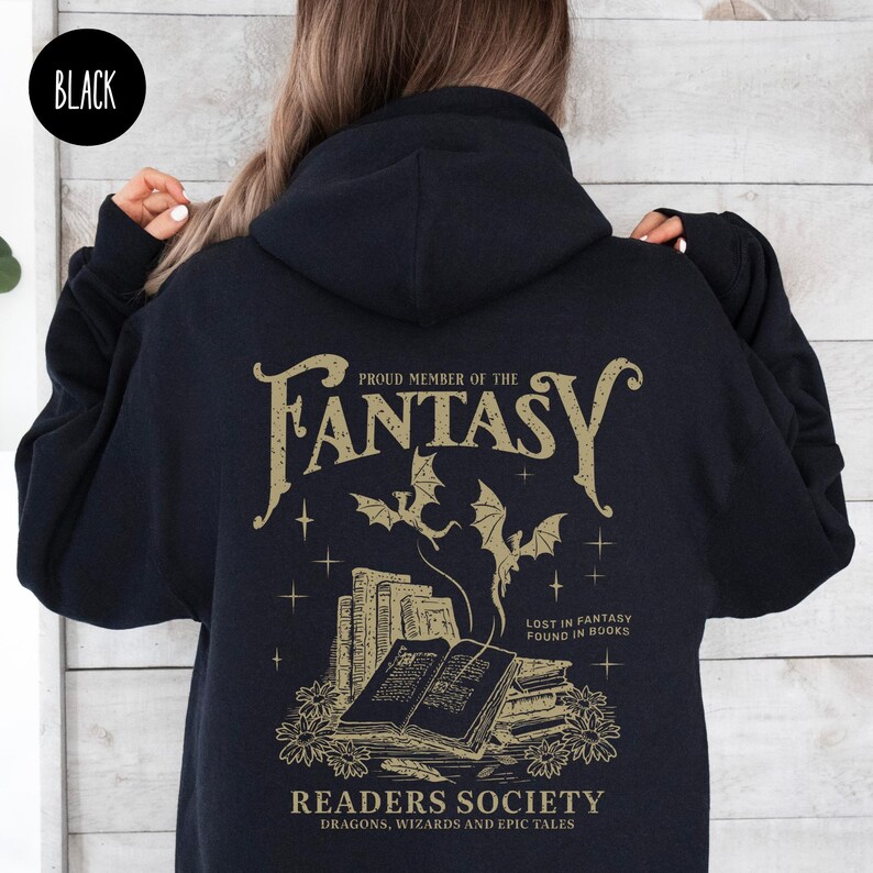 May include: Black hooded sweatshirt with a gold graphic print of a dragon and books. The text reads "Proud Member of the Fantasy Readers Society, Dragons, Wizards and Epic Tales".