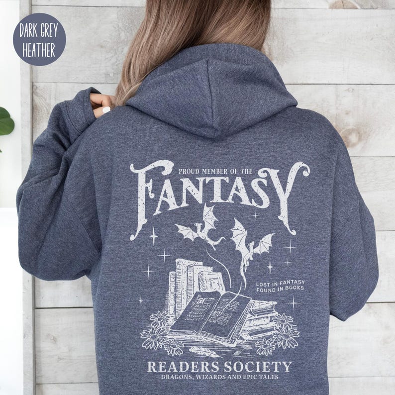 May include: Dark heather grey hoodie with a white graphic print of a stack of books, dragons, and the text "Proud Member of the Fantasy Readers Society. Dragons, Wizards and Epic Tales. Lost in Fantasy Found in Books."