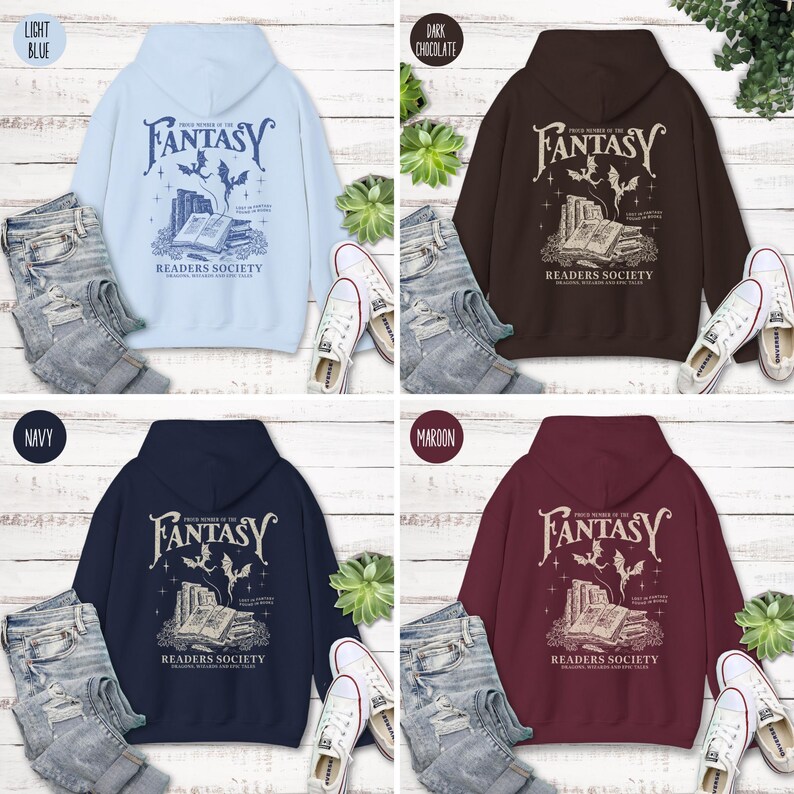 May include: Four hooded sweatshirts in different colors: light blue, dark chocolate, navy blue, and maroon. Each sweatshirt features a graphic print of a book with a dragon and the text "Once Upon a Time in the Fantasy Readers Society".
