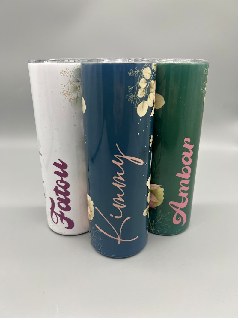 Custom tumblers with floral patterns, names Fatou, Kimmy, Ambar in script, bridesmaid gift idea.