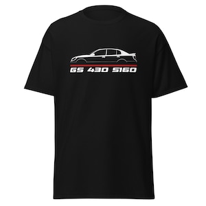 May include: Black t-shirt featuring a white side profile of a car with the text "GS 430 S160" in white font above a red stripe. The car graphic is a sleek, minimalist design.