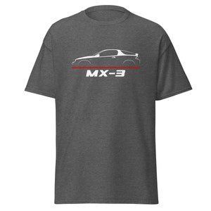 May include: A dark heather grey t-shirt featuring a white silhouette of a Mazda MX-3 car and the text "MX-3" in white.