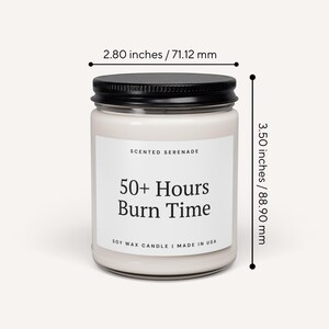 a white candle labeled "Scented Serenade" with a black cap. The candle is described as having a 50+ Hours Burn Time and is made in the USA. The candle is approximately 2.80 inches tall, with a 712 mm height.