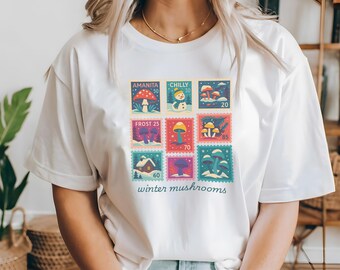 Amanita Winter Shirt | Snowy Mushroom Stamp Tee, Frosty Nature & Cabin Scene Graphic
