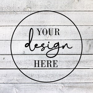 May include: Whitewashed wood background with a black circle containing the text "YOUR design HERE" in black.