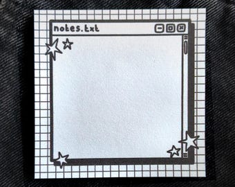 May include: A square sticker with a black and white grid pattern. The sticker features a stylized computer window design with the text "notes.txt" at the top. Decorative star shapes are in each corner.