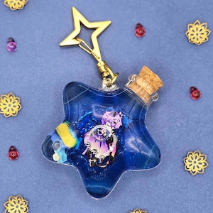 May include: A set of three ceramic mugs with a speckled, matte finish. The mugs are in shades of cream, light gray, and dark gray. Each mug has a simple, minimalist design, perfect for coffee or tea.