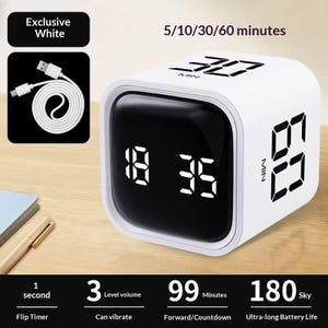 May include: A white cube-shaped digital flip timer with a black display screen showing 18:35. The device features 5/10/30/60 minute settings, a USB charging cable, 3 volume levels, vibration mode, 99-minute countdown, and 180-day battery life.