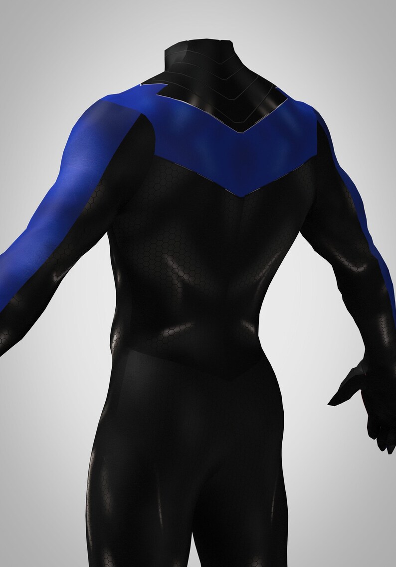 May include: A black long-sleeve bodysuit featuring a blue chevron-shaped emblem across the upper chest and shoulders. The black fabric has a subtle hexagonal texture pattern throughout, while the blue sections are smooth and solid in color.