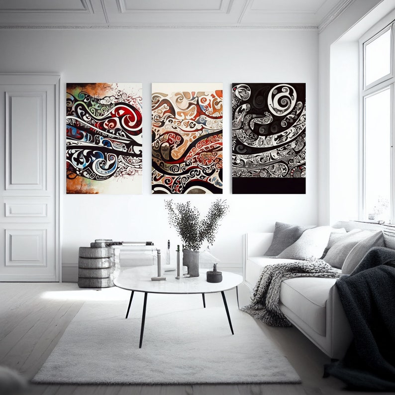 May include: Three abstract art prints with black, white, red, blue, and brown swirling patterns. The prints are framed and hung on a white wall in a living room setting.