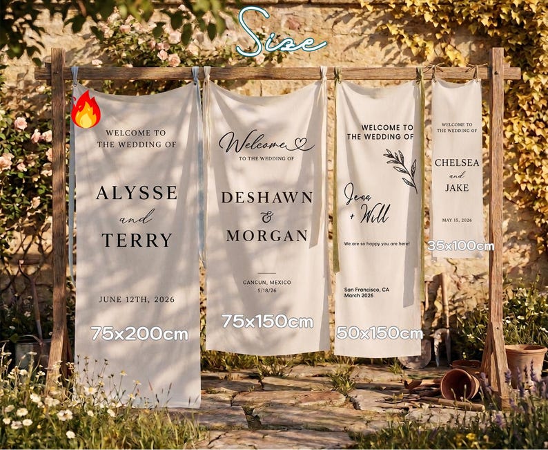 May include: Four white wedding banners with black text, displayed on a wooden frame. The banners vary in size, with the largest measuring 75x200cm. Each banner welcomes guests to a wedding, with names and dates. The banners are set outdoors.
