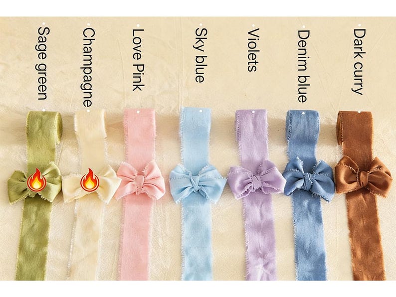 May include: A collection of colorful ribbons in sage green, champagne, love pink, sky blue, violets, denim blue, and dark curry. Each ribbon features a matching bow. The colors are labeled above each ribbon.