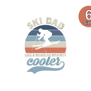 May include: Embroidered design with the text "SKI DAD" and a skier silhouette, accompanied by the phrase "LIKE A REGULAR DAD BUT cooler". The design is set against a striped background in blue, beige, and orange. A circular label indicates six sizes.