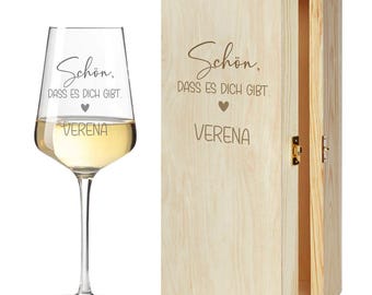 May include: A wooden box with a hinged lid and a glass wine glass. The box and glass are engraved with the text "Schön, dass es dich gibt." and the name "Verena".