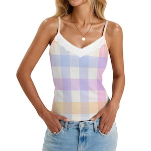 May include: A pastel plaid camisole with a white lace trim along the neckline. The tank top features a pattern of light blue, lavender, yellow, and pink squares. The straps are thin and the top is made of a soft material.