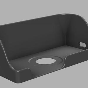 May include: A gray plastic case designed to protect a security camera. The case has a cutout for the camera lens and a slot for mounting.