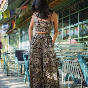 a boho matching set of cotton black floral crop top and matching block printed flare pants for women summer vacation- Odhanon