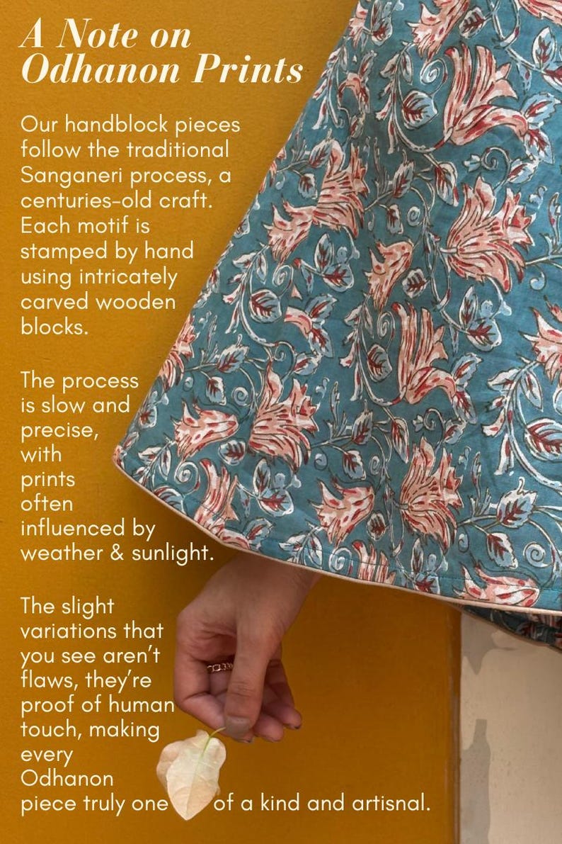 May include: Text on a mustard yellow background reads "A Note on Odhanon Prints". A section of a teal fabric with a floral pattern in pink and white is visible. The text describes the hand-block printing process.