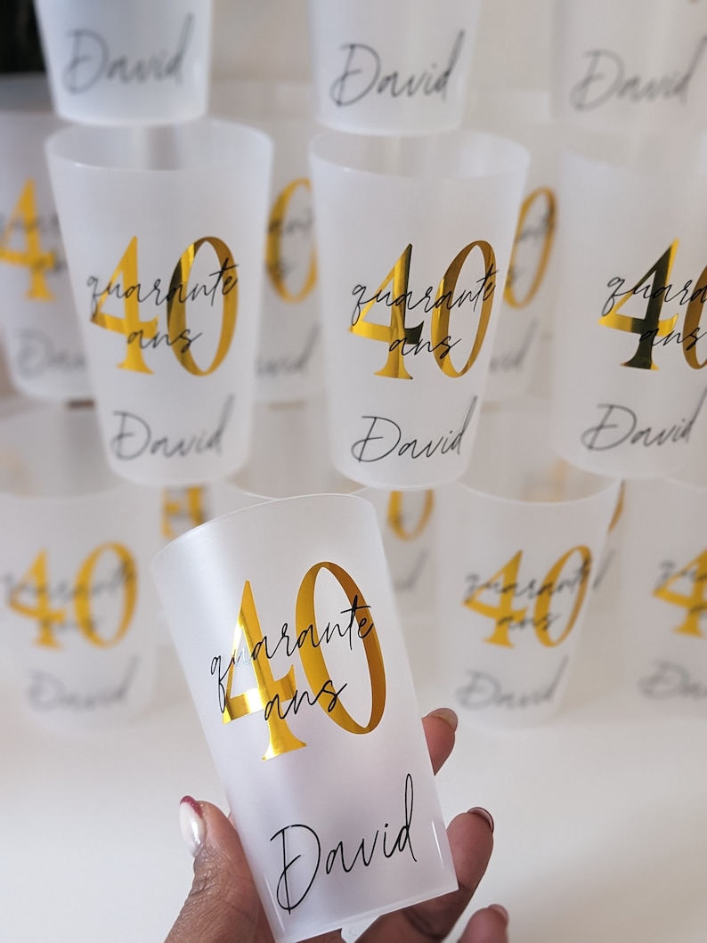 May include: Clear plastic cups with gold lettering that says "quarante ans" and "David".