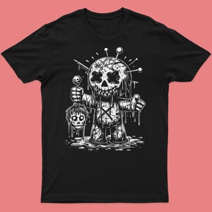 May include: Black and white illustration of a voodoo doll with pins sticking out of its head and dripping with blood. The doll is holding a severed head in its hand.